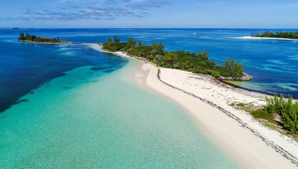 Aerial view of Munjack Cay with bay and beach in Abaco, Bahamas