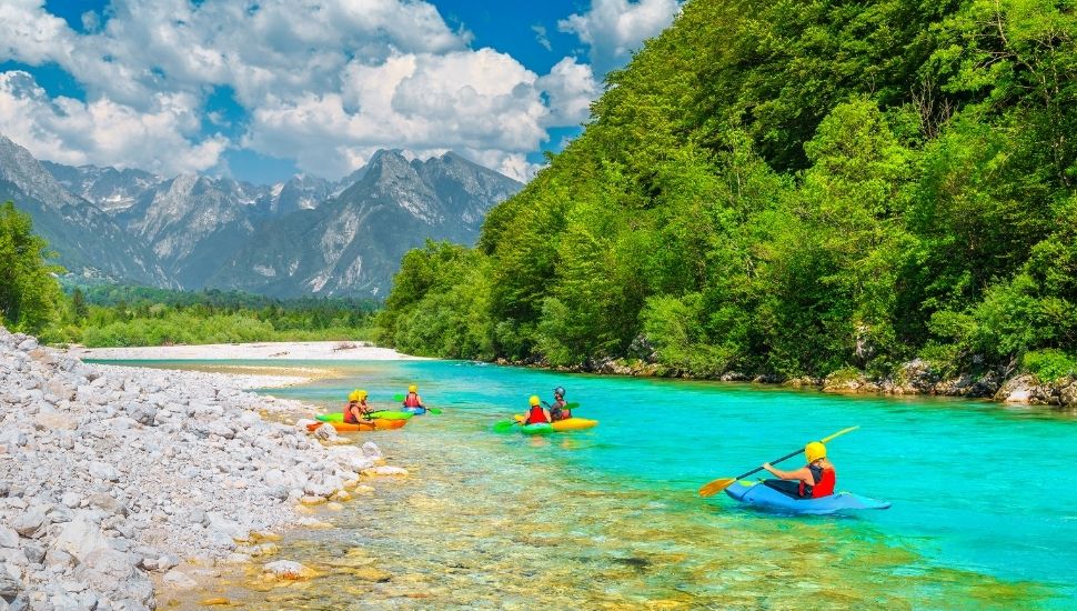 Kayakers on the famous turquoise Soca river, Bovec, Slovenia