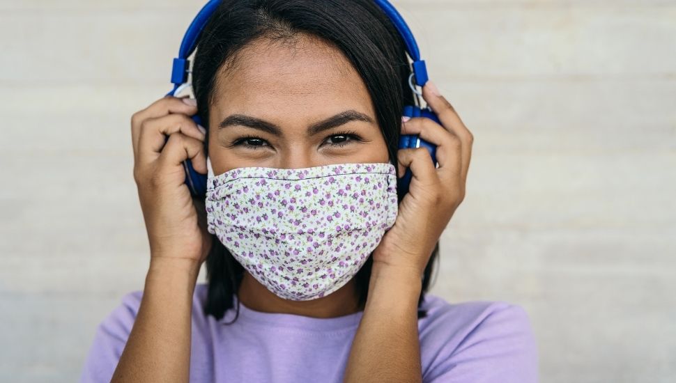 Young girl wearing protective facemask