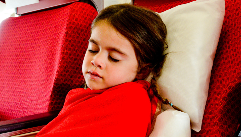 Child asleep on airplane