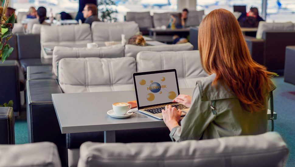 Business traveller working in airport lounge