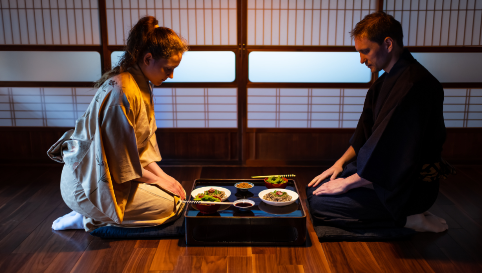 Young couple at traditional Japanese restaurant, eating kaiseki