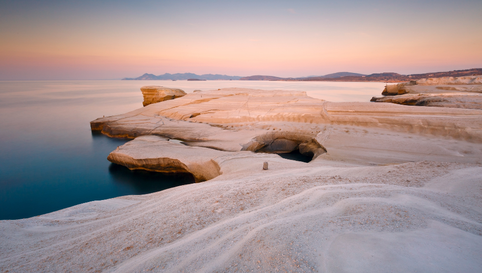 Pale volcanic rocks near Sarakiniko beach in Milos island, Greece.